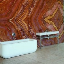 Red Onyx Bookmatched Wall in Bathroom