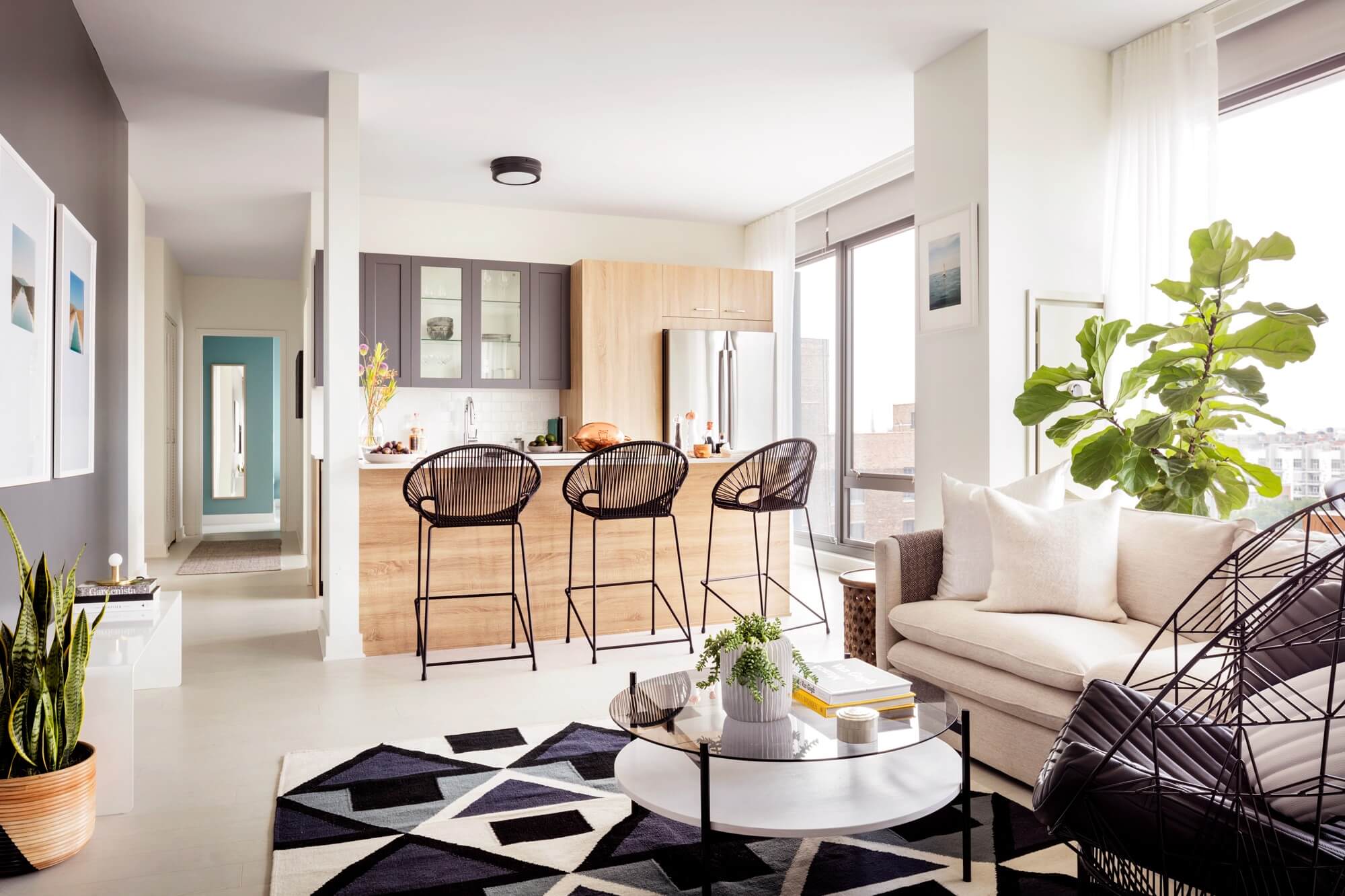 Modern kitchen with custom stone countertops and sleek cabinetry at Landmark West Loop project